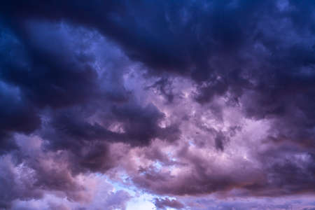 Dark clouds in the sky before thunderstorm. The clouds flow rapidly in the sky.