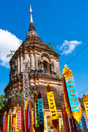 Ancient pagoda with the zodiac flags at Wat Lok Molee in Chiang Mai province Thailand.