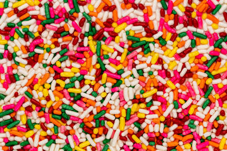 Top view closeup colorful rainbow candy sprinkles on the floor.の写真素材