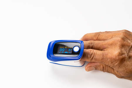 High angle view of doctor using pulse oximeter measured blood value of pulse rate and value of...