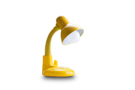 Side view of yellow desk lamp isolated on white backgroundの写真素材