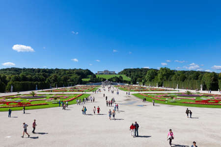 Vienna, Austria - August 9, 2011 : Beautiful Schonbrunn Palace garden with Gloriette in the background and tourists walking around in Vienna, Austria.のeditorial素材