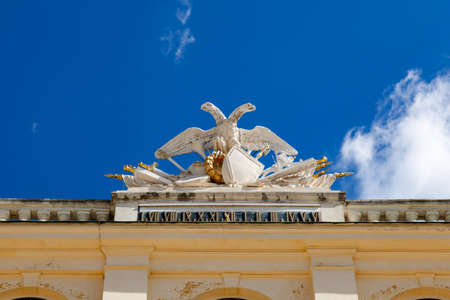 Low angle view of eagle sculpture decorated on the roofline at Schonbrunn Palace in Vienna, Austria.のeditorial素材
