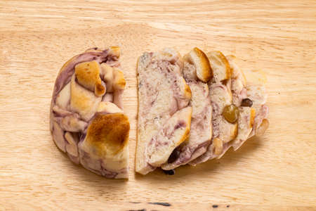 High angle view pieces of homemade Purple Sweet Potato Bread with mixed bean and the slices on...