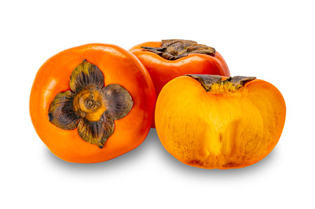 Ripe Persimmon fruit, Diospyros kaki, Chinese Persimmon, Japanese Persimmon, whole and a half isolated on white background with clipping path.の写真素材