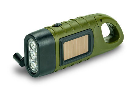 Side view of mini solar cranking LED flashlight isolated on white background with clipping path. This device charge battery by solar cells or  turning dynamo handle.の写真素材