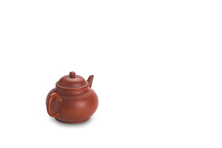 Old clay chinese teapot with copy space isolated on white background with clipping path.の写真素材