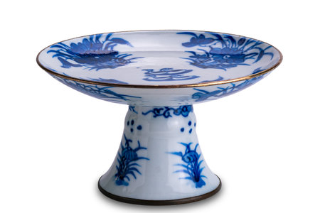 Closeup view of ancient blue pattern chinese ceramic footed tray isolated on white background with clipping path.の写真素材