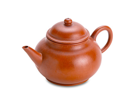 High angle view of old clay chinese teapot isolated on white background with clipping path.の写真素材