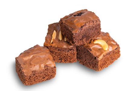 Pile of homemade chocolate brownies isolated on white background with clipping path.の写真素材