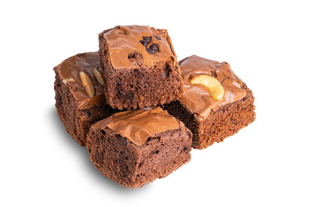 Pile of delicious homemade chocolate brownies isolated on white background with clipping path.の写真素材