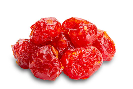 Pile of homemade dehydrated cherry tomatoes isolated on white background with clipping path.の写真素材