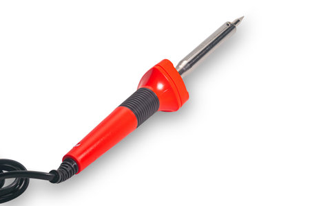 High angle view of new modern red handle soldering iron with black cable isolated on white...