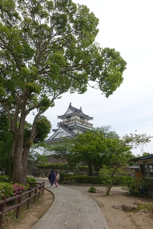 a couple wearing Japanese style kimono walking in Kitsuki castle park in Oita, Japan, May 2, 2016