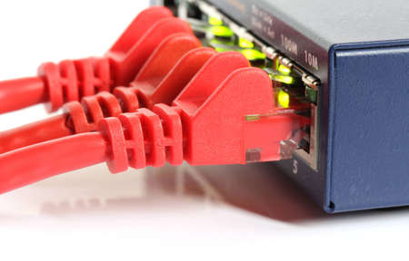 network router switch with red cables and green lights isolated on white background