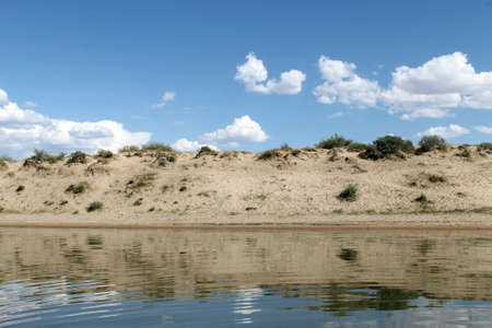the sky reflected in the water, deserted beach lake, summer sky, nature, blue cloud,の写真素材