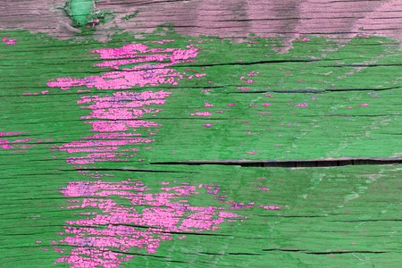 old blue board with cracked paint, vintage wood background, grunge plank. Old wooden background with remains of pieces of scraps of old paint on wood. Texture of an old tree, board with paint, vintage background peeling paint. old blue board with cracked paintの写真素材