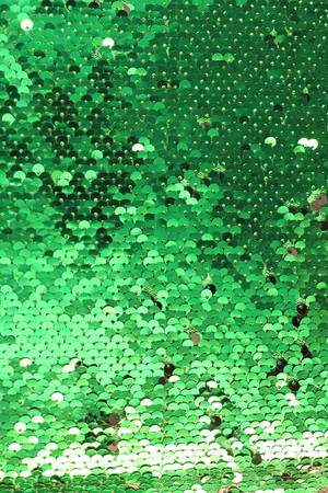 sequins as background, round sequins in fashion dress, Colorful sequined texture. metallic sparkling sequins scales backgroundの写真素材