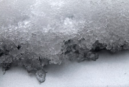 melting snow on the glass. sleet on glass. lace grey textureの写真素材