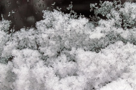 melting snow on the glass. sleet on glass. lace grey textureの写真素材