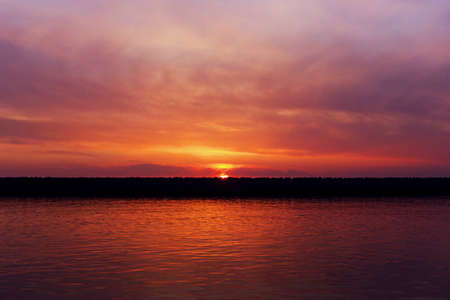 purple sunset on the seaの写真素材