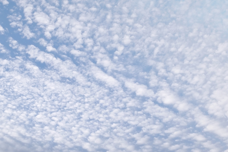 Cirrocumulus clouds in the clear bright blue sky in the sunny day