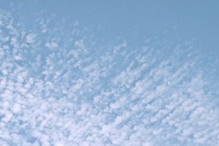 Cirrocumulus clouds in the clear bright blue sky in the sunny day