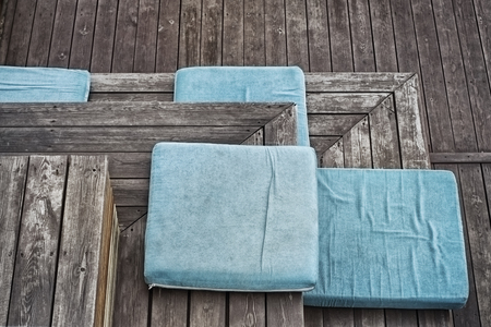 Turquoise plush seat pad on the boardwalk stairs