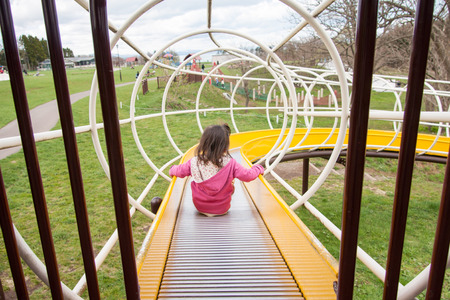 Children playing on the slideの写真素材