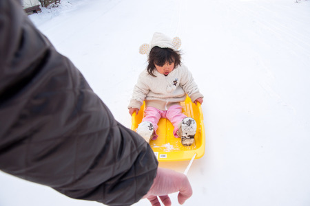 Children rode the sledの写真素材