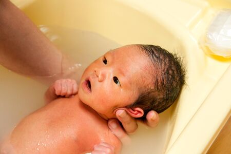 Baby in bathの写真素材