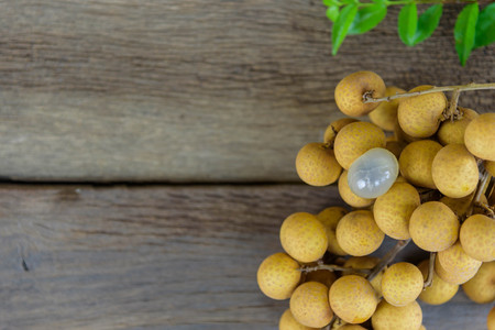 Longan on the wooden floorの写真素材