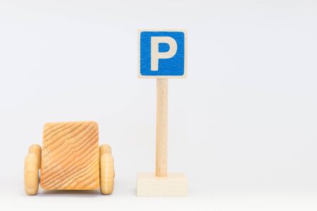 Traffic sign and wooden carの写真素材