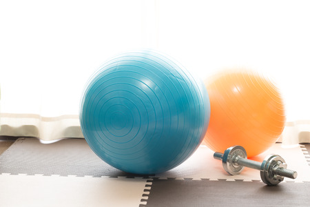 Exercise ball and dumbbellの写真素材