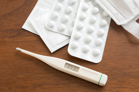 A thermometer and medicine