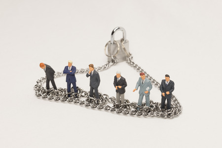 Businessmen in chainsの写真素材