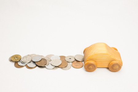 Wooden car and moneyの写真素材