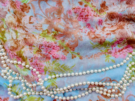 summer bright juicy colorful background floral textile light fabric cotton with white round pearls...