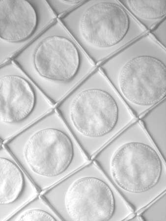 background cotton swabs and cotton pads cosmetic products for cleaning and hygiene of the face femaleの写真素材