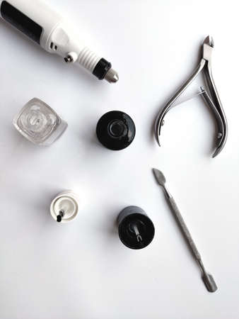 Manicure and pedicure tools isolated on white background black and white nail polish and nippersの写真素材