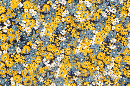 Fabric texture with white and yellow daisiesの写真素材