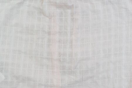 Texture of gray fabric in a small cageの写真素材