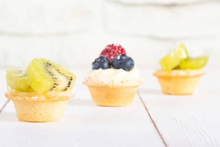Fresh fruit tartlets on the table macroの写真素材