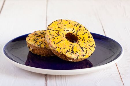 Beautiful shortbread on a dark plate on the wite tableの写真素材