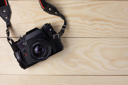 Old camera on  wooden backgroundの写真素材