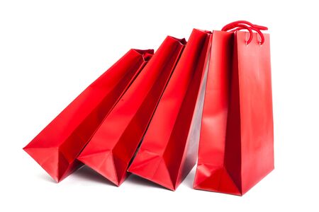 red paper shopping bags isolated on whiteの写真素材