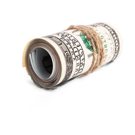 roll of one hundred dollar isolated on whiteの写真素材