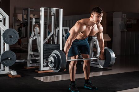 Muscular Man Doing Heavy Deadlift Exerciseの写真素材