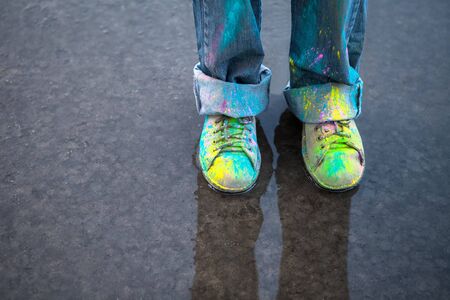 Bright dust on Vintage colorful shoes on puddleの写真素材