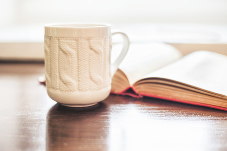 Coffee cup and open book close upの写真素材